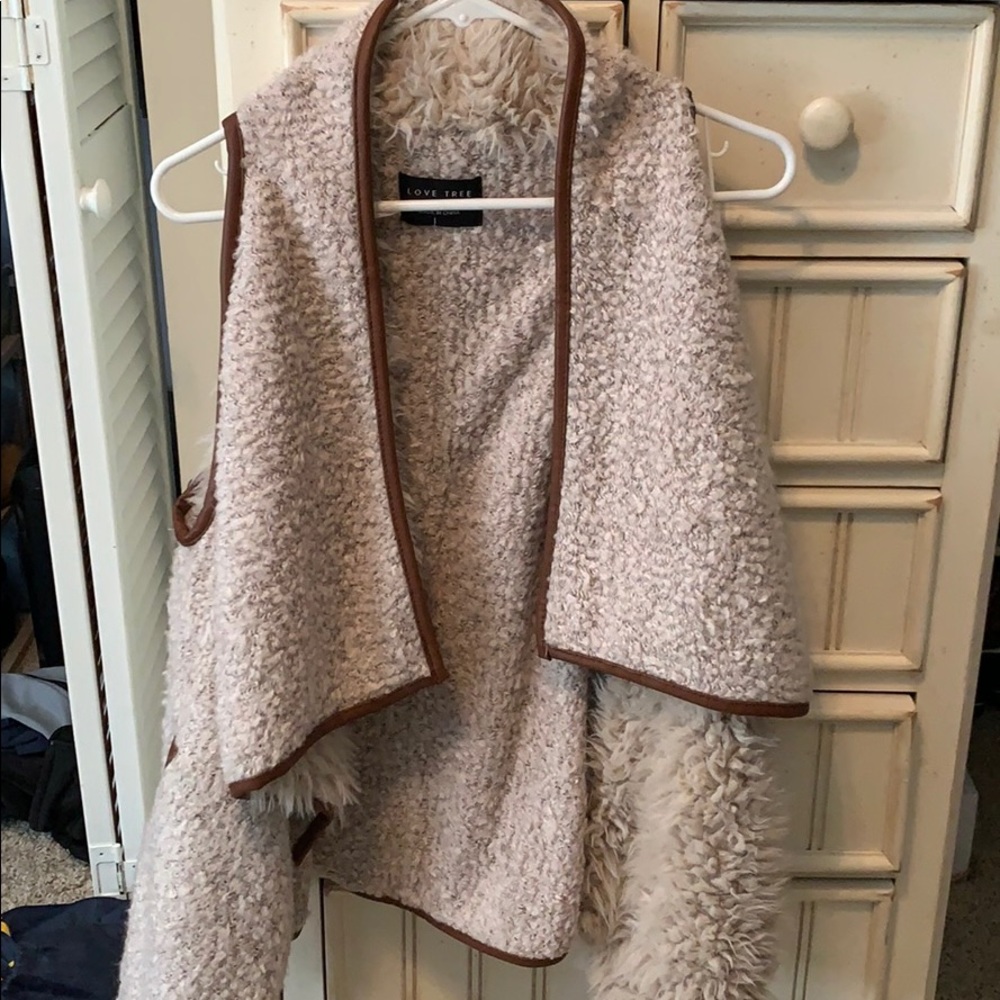 Tan with brown leather trip fur vest!